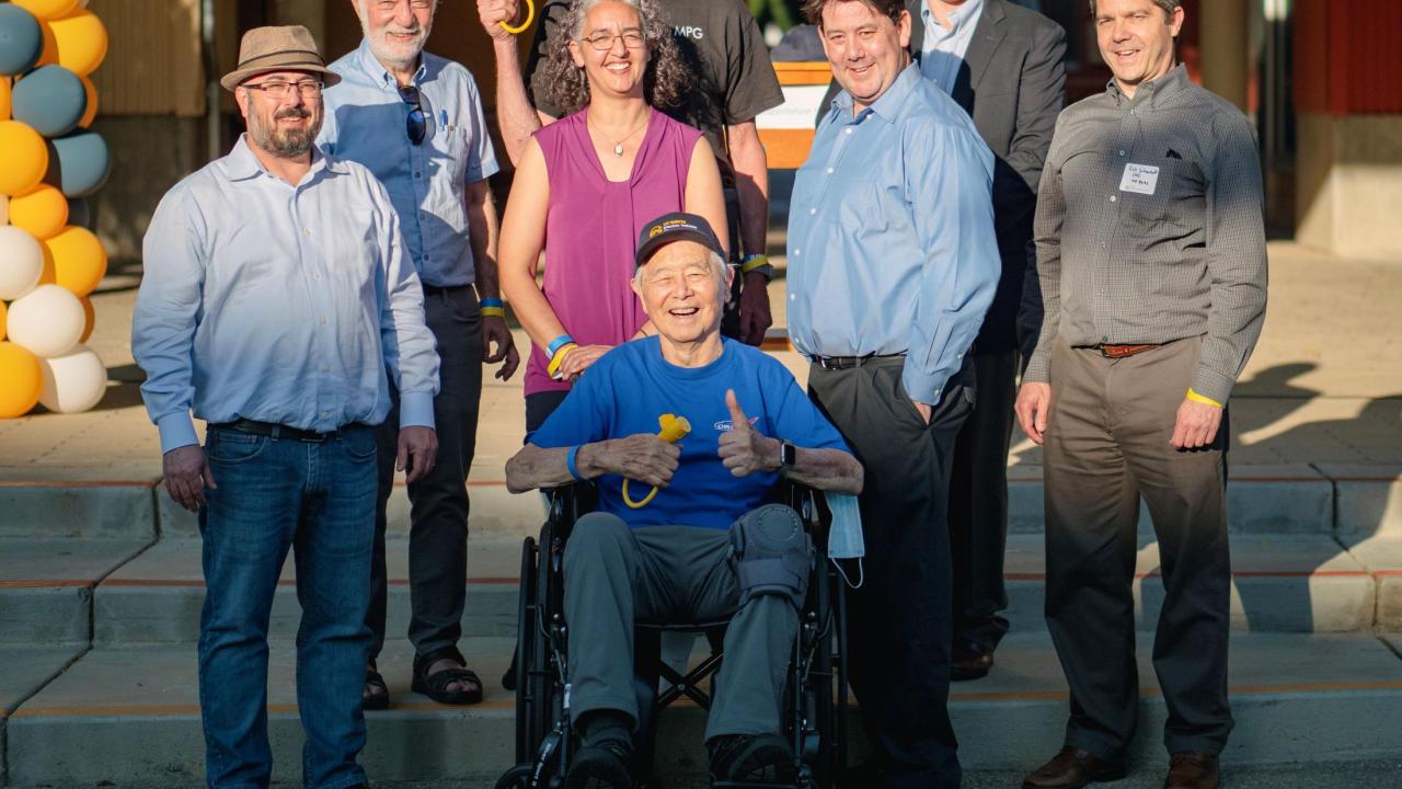 Sunny photo of Gil Tal, Dan Sperling, Dahlia Garas, Felix Kramer, Chris Nitta, Mark Duvall and Rob Schurhoff surrounding Dr. Andy Frank